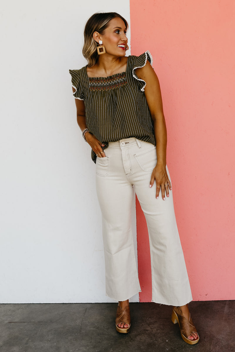 The Riven Striped Embroidered Ruffle Top