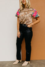 The Alaia Vegan Leather Straight Leg Pants