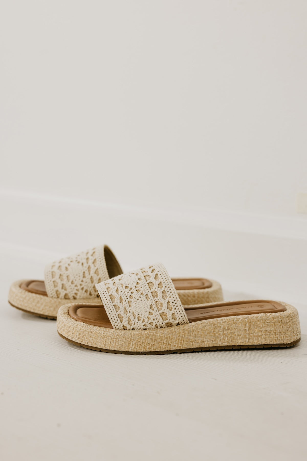 The Capria Raffia Wedged Sandal